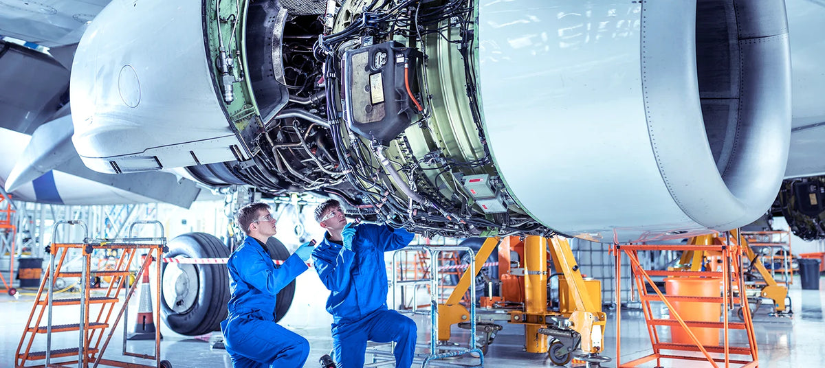 Engineers servicing equipment - maintenance, AMC and asset labelling